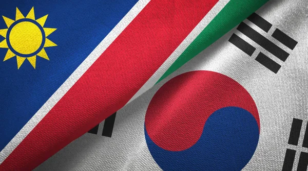 Namibia y Corea del Sur dos banderas tela textil, textura de la tela — Foto de Stock