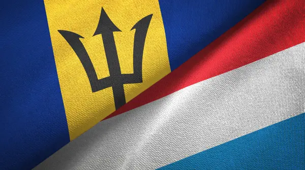 Barbados e Lussemburgo due bandiere tessuto, tessitura tessuto — Foto Stock