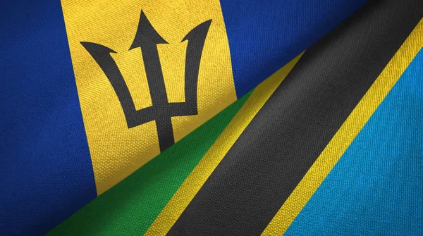 Barbados en Tanzania twee vlaggen textiel doek, stof textuur — Stockfoto