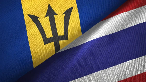 Барбадос и Таиланд два флага текстильная ткань, текстура ткани — стоковое фото