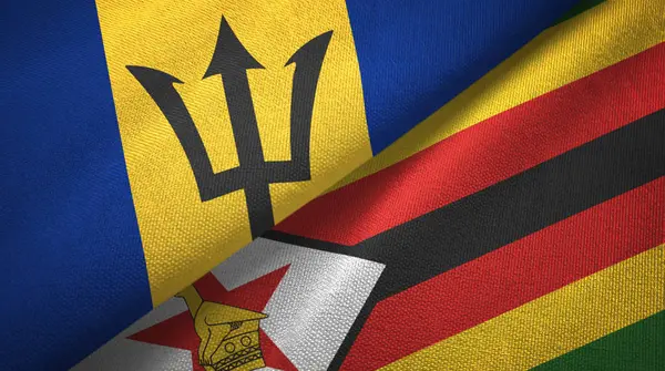 Barbados e Zimbábue duas bandeiras de pano têxtil, textura de tecido — Fotografia de Stock
