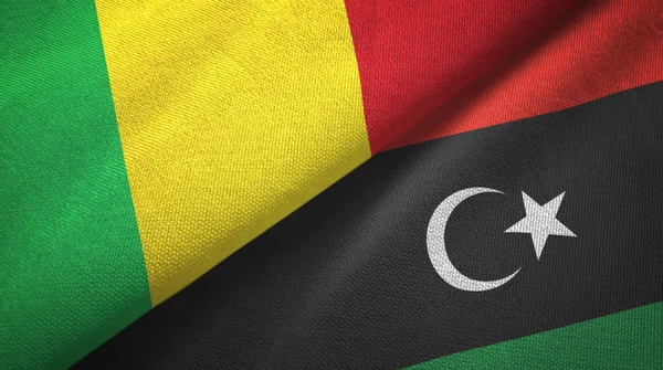 Malí y Libia dos banderas tela textil, textura de la tela —  Fotos de Stock