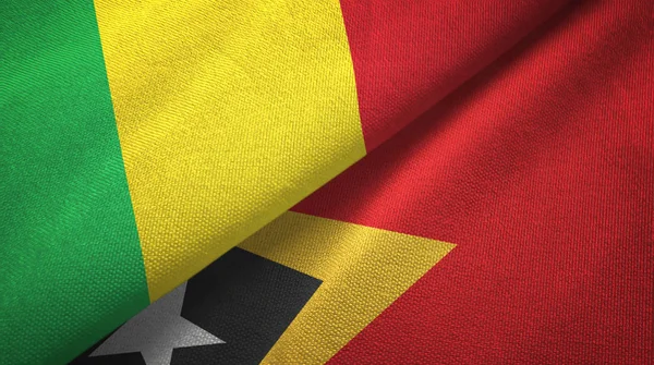 Mali e Timor Est Timor Est due bandiere tessuto, tessitura del tessuto — Foto Stock