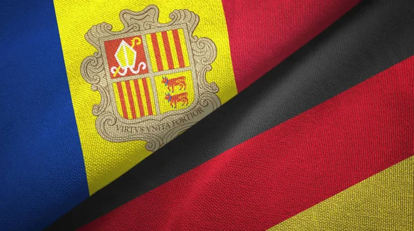 Andorra y Alemania dos banderas de tela textil, textura de tela —  Fotos de Stock