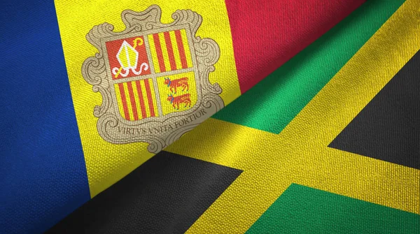 Andorra y Jamaica dos banderas de tela textil, textura de tela — Foto de Stock