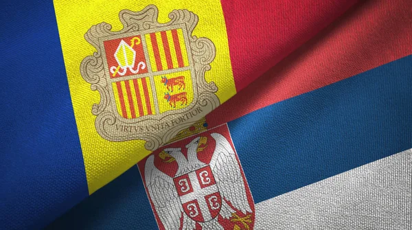 Andorra e Sérvia duas bandeiras pano têxtil, textura de tecido — Fotografia de Stock