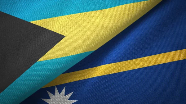 Bahama-szigetek és Nauru két zászlók textil ruhával, szövet textúra — Stock Fotó