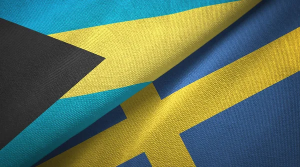 Bahamas y Suecia dos banderas tela textil, textura de la tela — Foto de Stock