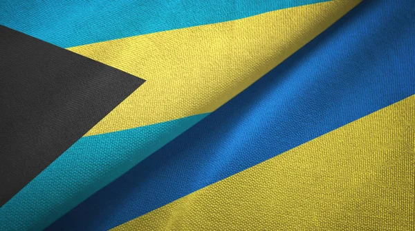 Bahama-szigetek és Ukrajna két zászló textil ruhával, szövet textúra — Stock Fotó