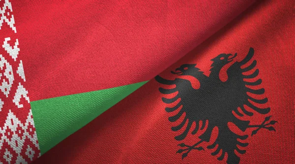 Belarus and Albania two flags textile cloth, fabric texture