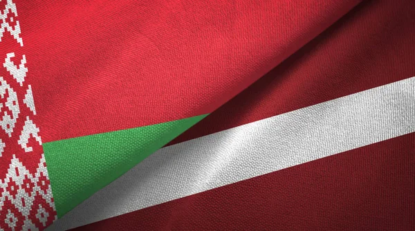 Belarus and Latvia two flags textile cloth, fabric texture — Stock Photo, Image