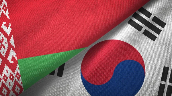 Bělorusko a Jižní Korea dvě vlajky textilní tkaniny, textura textilií — Stock fotografie