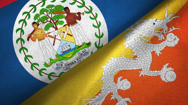 Belize e Bhutan due bandiere tessuto, tessitura del tessuto — Foto Stock