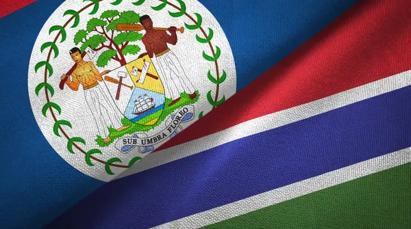 Belize en Gambia twee vlaggen textiel doek, stof textuur — Stockfoto