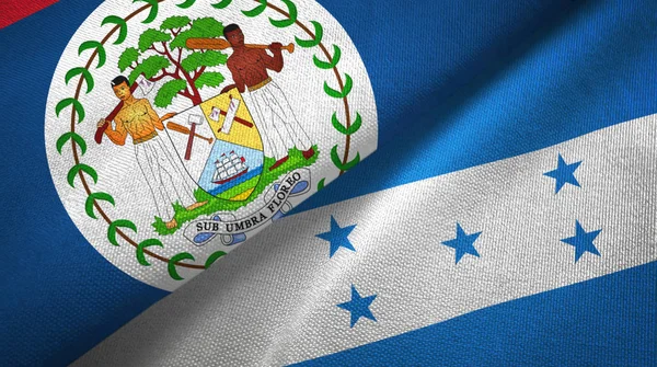 Belize i Honduras dwie flagi tkanina tekstylna, tekstura tkaniny — Zdjęcie stockowe