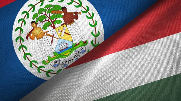 Belize e Ungheria due bandiere tessuto, tessitura tessuto — Foto Stock