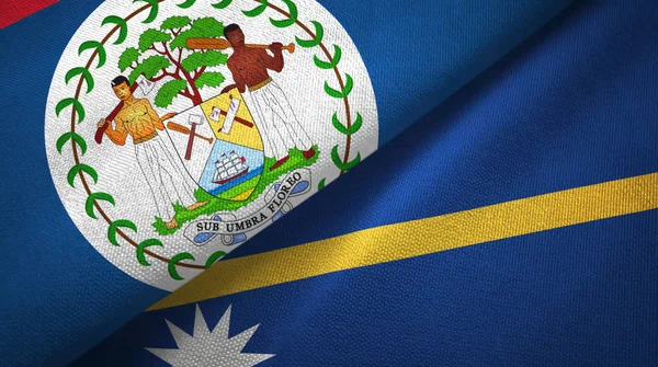 Belize en Nauru twee vlaggen textiel doek, stof textuur — Stockfoto