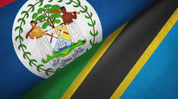 Belize en Tanzania twee vlaggen textiel doek, stof textuur — Stockfoto