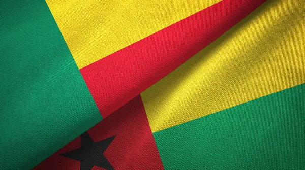 Benin e Guinea-Bissau due bandiere tessuto, tessitura del tessuto — Foto Stock