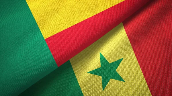 Benin és Szenegál két zászló textil ruhával, szövet textúra — Stock Fotó