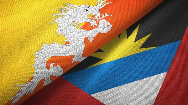 Bután y Antigua y Barbuda dos banderas tela textil, textura de la tela — Foto de Stock