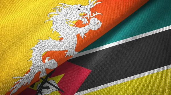 Bhutan i Mozambik dwie flagi tkanina tekstylna, tekstura tkaniny — Zdjęcie stockowe