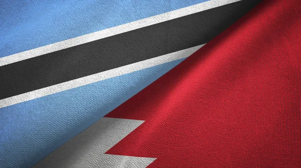 Botswana und Bahrain zwei Flaggen Textiltuch, Textur — Stockfoto