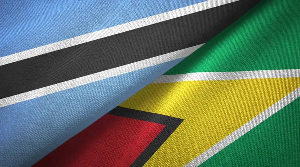Botswana und Guyana zwei Flaggen Textilstoff, Textur — Stockfoto