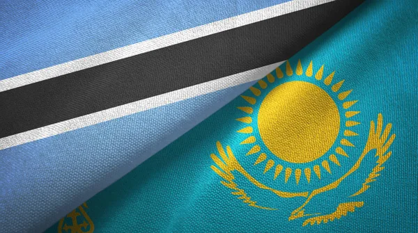 Botswana y Kazajstán dos banderas tela textil, textura de la tela — Foto de Stock