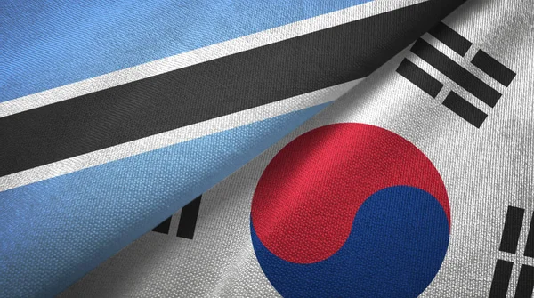 Botswana e Corea del Sud due bandiere tessuto, tessitura del tessuto — Foto Stock