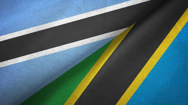 Botswana und Tansania zwei Flaggen Textilstoff, Textur — Stockfoto