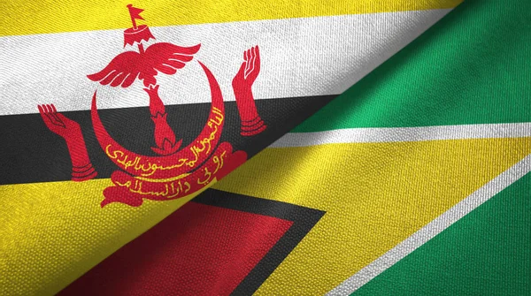 Brunei y Guyana dos banderas tela textil, textura de la tela — Foto de Stock