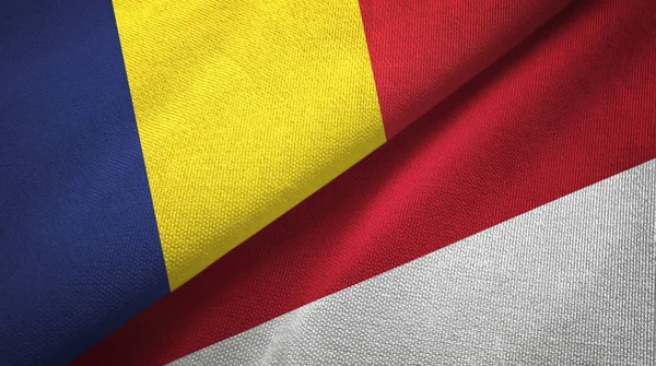 Tsjaad en Indonesië twee vlaggen textiel doek, weefsel textuur — Stockfoto