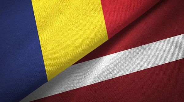 Tsjaad en Letland twee vlaggen textiel doek, weefsel textuur — Stockfoto