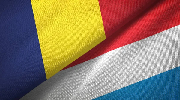 Tsjaad en Luxemburg twee vlaggen textiel doek, weefsel textuur — Stockfoto