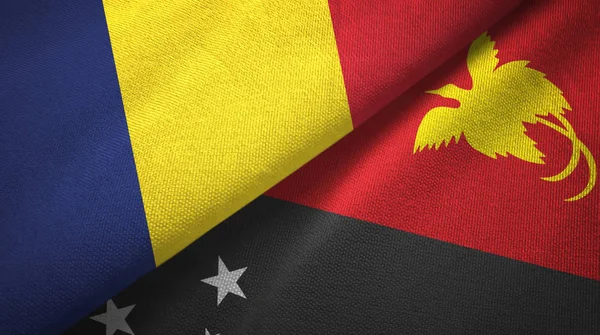 Tsjaad en Papoea-Nieuw-Guinea twee vlaggen textiel doek, stof textuur — Stockfoto