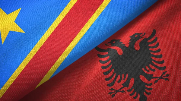 Congo Democratische Republiek en Albanië twee vlaggen textiel doek, stof textuur — Stockfoto