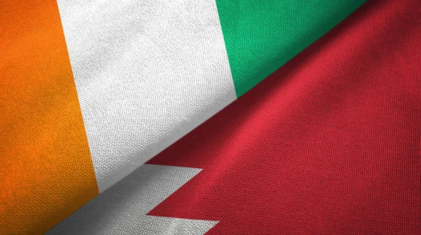 Cote dIvoire and Bahrain two flags textile cloth, fabric texture — Stock Photo, Image