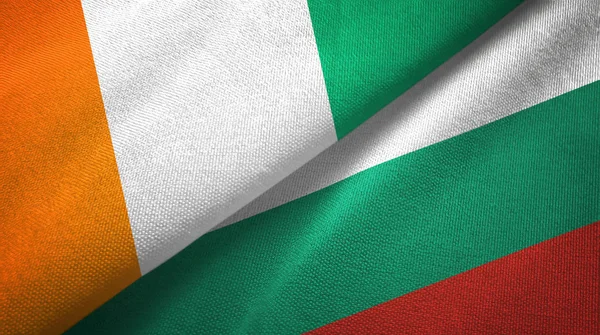 Cote divoire und bulgaria zwei flaggen textiltuch, textur — Stockfoto