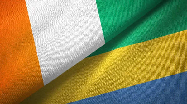 Cote divoire ve Gabon iki bayraklar tekstil kumaş, kumaş doku — Stok fotoğraf