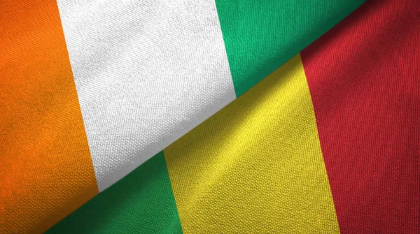 Cote Divoire och Mali två flaggor textil trasa, tyg konsistens — Stockfoto