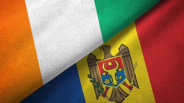 Cote dIvoire and Moldova two flags textile cloth, fabric texture — Stock Photo, Image