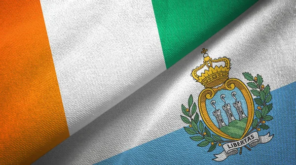 Cote Czad i San Marino dwie flagi tkanina tekstylna, tekstura tkaniny — Zdjęcie stockowe