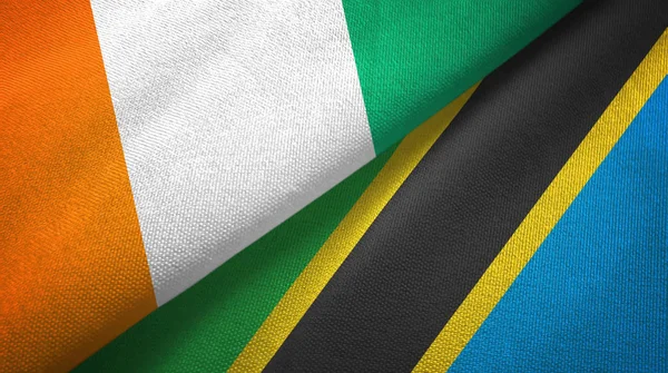 Costa d'Avorio e Tanzania due bandiere tessuto, tessitura tessuto — Foto Stock