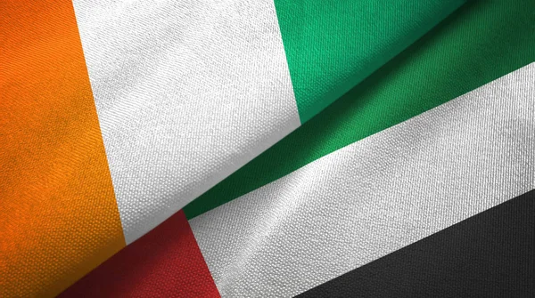 コートディボアとアラブ首長国連邦2つの旗織物布、生地の質感 — ストック写真