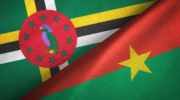 Dominica i Burkina Faso dwie flagi tkanina tekstylna, tekstura tkaniny — Zdjęcie stockowe
