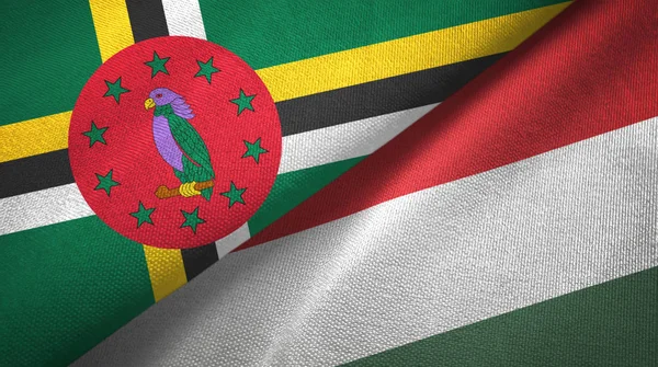 Dominica en Hongarije twee vlaggen textiel doek, weefsel textuur — Stockfoto