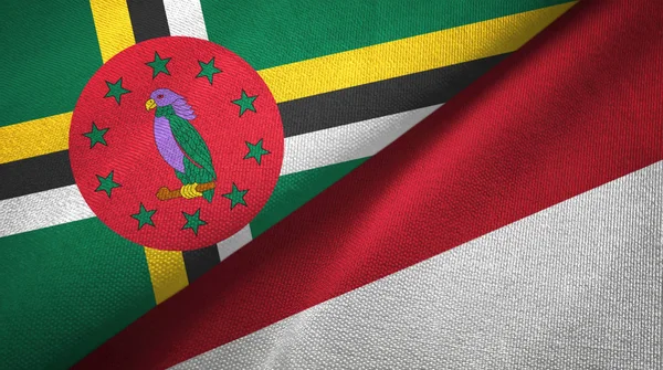 Dominica en Indonesië twee vlaggen textiel doek, weefsel textuur — Stockfoto