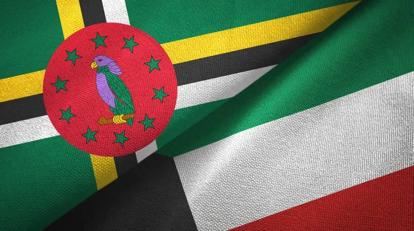 Dominica en Koeweit twee vlaggen textiel doek, weefsel textuur — Stockfoto