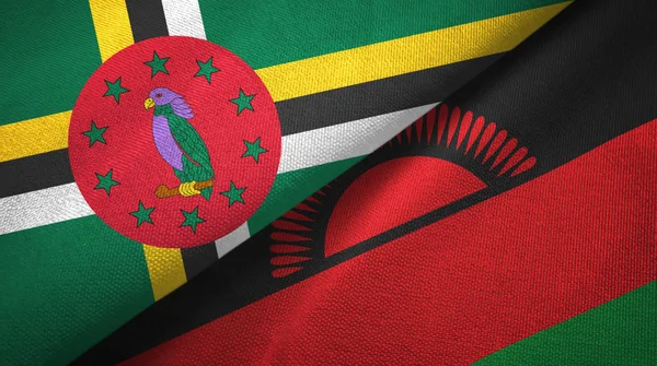 Dominique et Malawi deux drapeaux tissu textile, texture du tissu — Photo